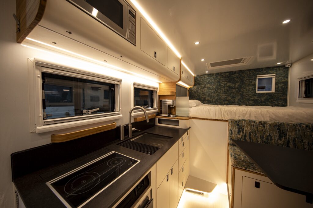 Galley kitchen and bed inside the habitat